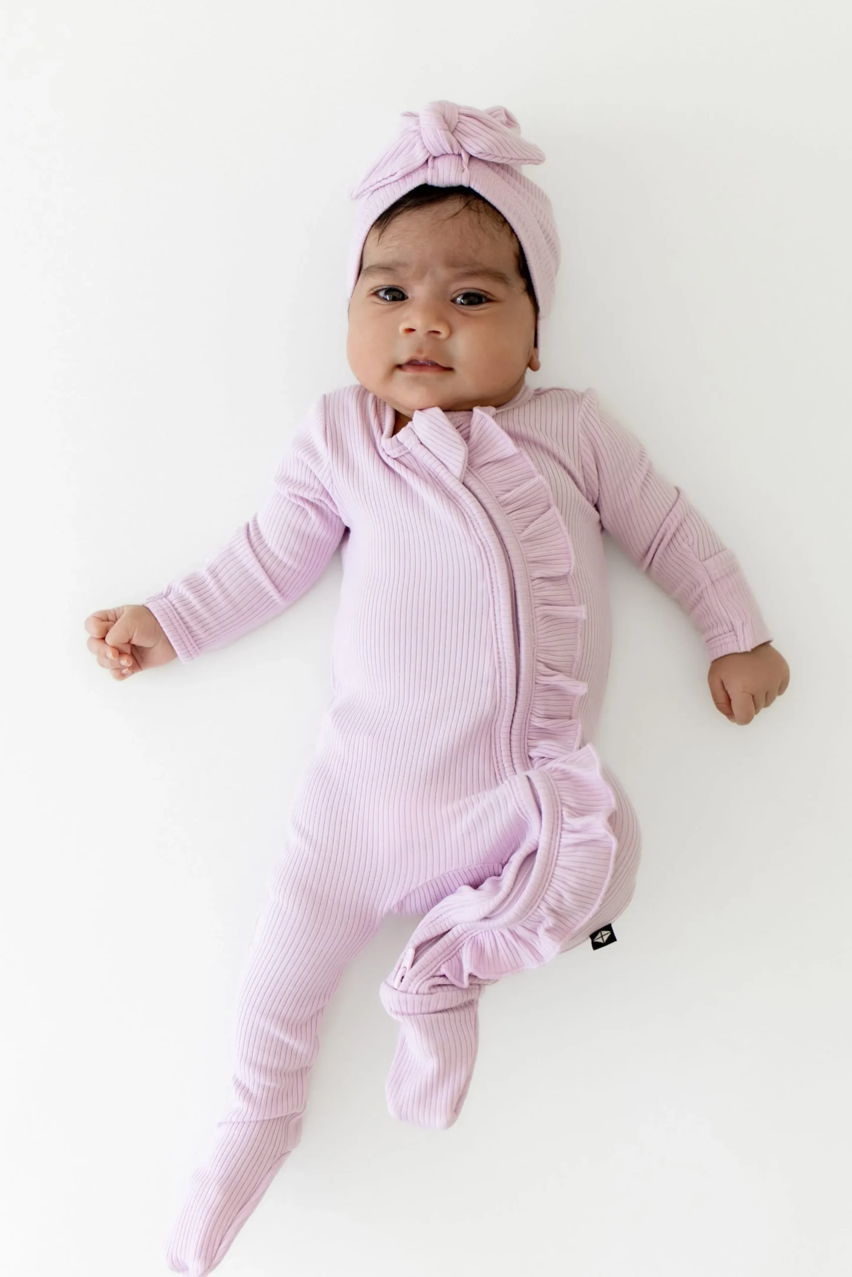 Ribbed Ruffle Zipper Footie in Thistle