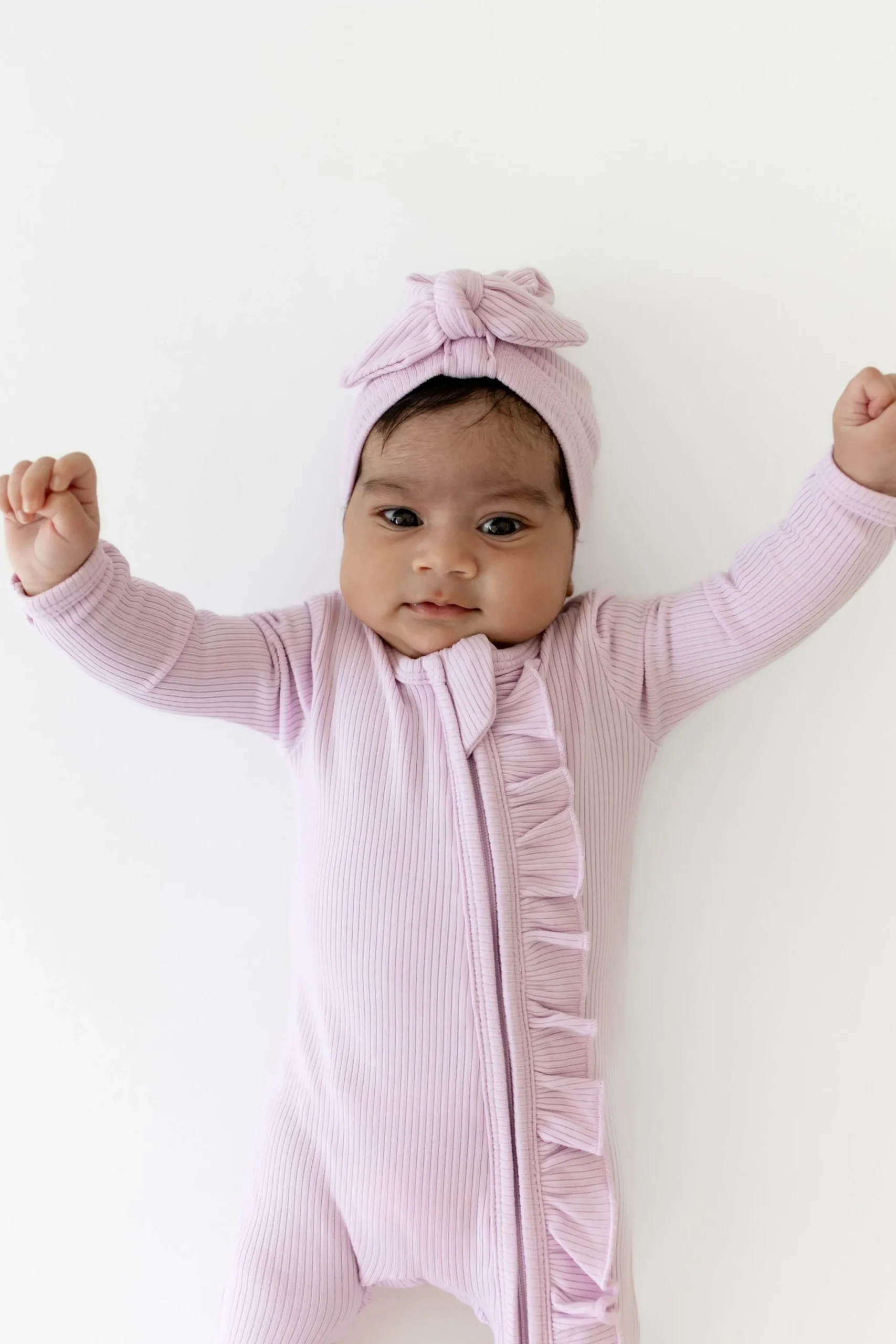 Ribbed Ruffle Zipper Footie in Thistle